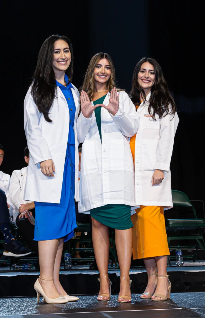 Gabriella Raffa, M.D.’17 (left) and Francesca Raffa, M.D. ’16 (right) pin sister Isabella Raffa, M.D. candidate, Class of 2027 Gabriella Raffa, M.D.’17 (left) and Francesca Raffa, M.D. ’16 (right) pin sister Isabella Raffa, M.D. candidate, Class of 2027