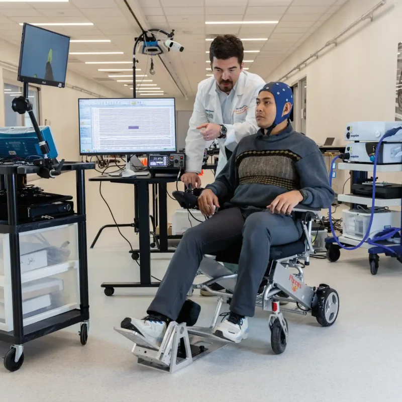 A patient and researcher working to help regain mobility